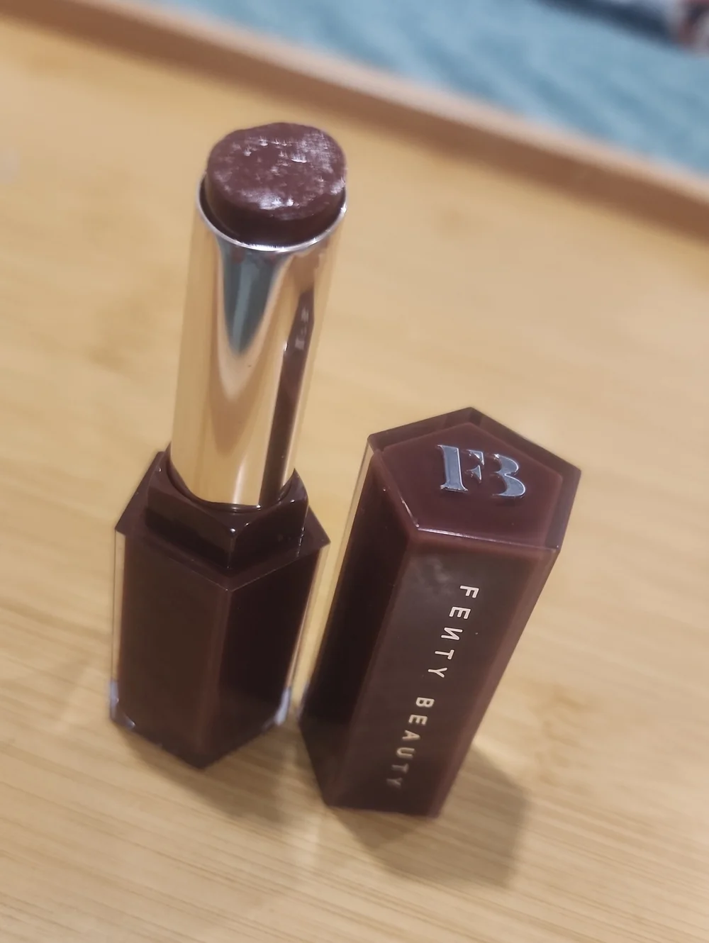 Fenty Beauty lipstick — deep chocolate brown